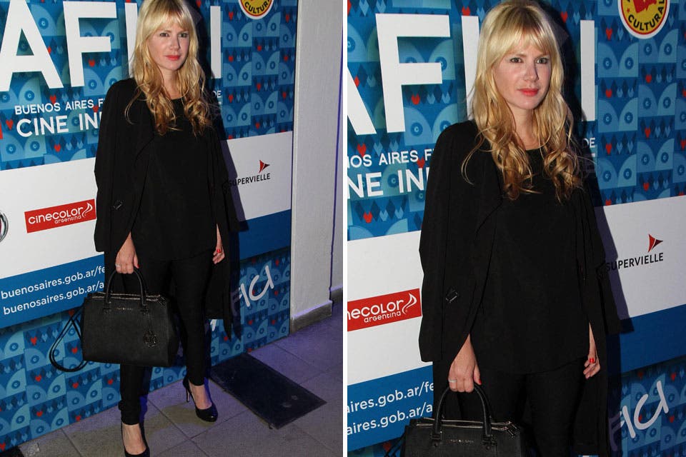 Esmeralda Mitre muy elegante con un look en negro que incluye capa, pantalones chupines y stilettos