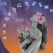 una mujer con flores mirando los signos del zodíaco