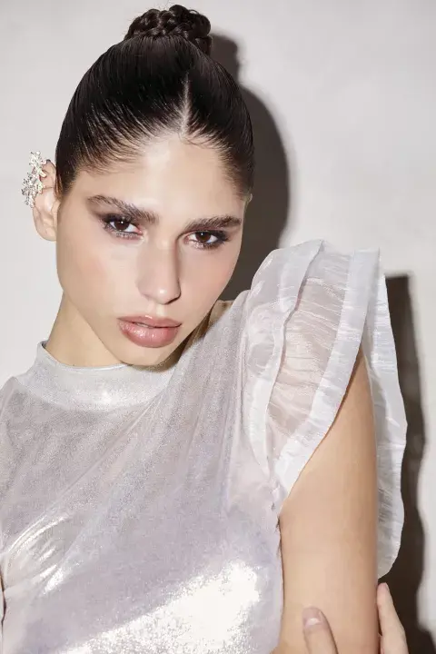 BODY (FINI BRAUN, $20.185), EARCUFF (LA REGUEIRA, $19.700). BODY (FINI BRAUN, $20.185), EARCUFF (LA REGUEIRA, $19.700).
