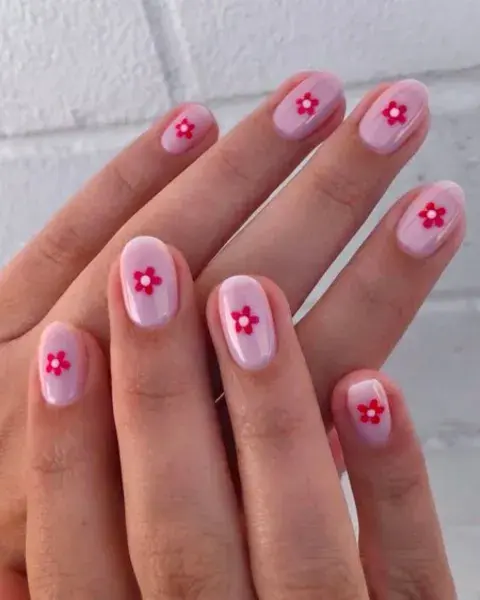 Sobre un transparente en tono rosa, una florcita roja que haga mucho contraste. Sobre un transparente en tono rosa, una florcita roja que haga mucho contraste.
