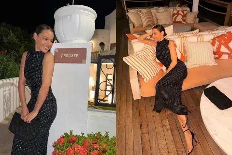 La modelo lució un vestido negro con brillos a lo largo de todo su diseño y con cuello alto La modelo lució un vestido negro con brillos a lo largo de todo su diseño y con cuello alto