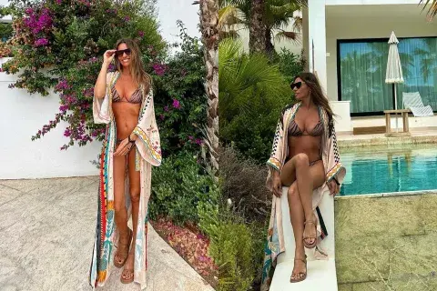 La modelo optó por una bikini animal print y sumó un kimono largo con aberturas laterales, estampado en tono crudo, rojo, naranja, turquesa y amarillo que combinaba perfecto con todo el outfit playero La modelo optó por una bikini animal print y sumó un kimono largo con aberturas laterales, estampado en tono crudo, rojo, naranja, turquesa y amarillo que combinaba perfecto con todo el outfit playero