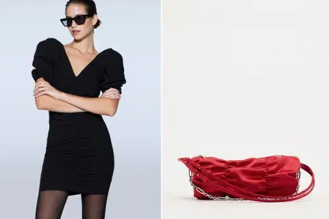 Un vestido negro drapeado y una cartera en color rojo Un vestido negro drapeado y una cartera en color rojo