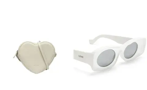 Una cartera de corazón en color blanca y unos lentes blancos