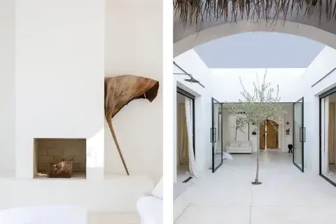 Los ambientes se comunican con el patio central a través de grandes ventanales de hierro y vidrio. Las cortinas de gasa le dan un aire etéreo y elegante al paso sutil entre exterior e interior Los ambientes se comunican con el patio central a través de grandes ventanales de hierro y vidrio. Las cortinas de gasa le dan un aire etéreo y elegante al paso sutil entre exterior e interior