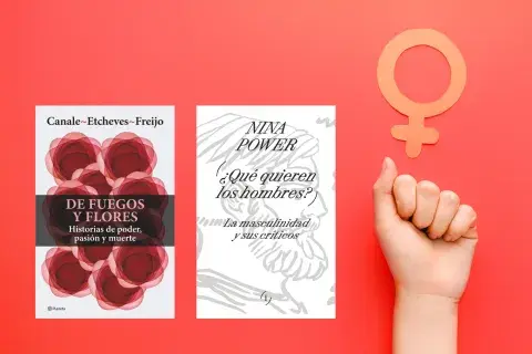 Un puño levantado y el símbolo del feminismo Un puño levantado y el símbolo del feminismo