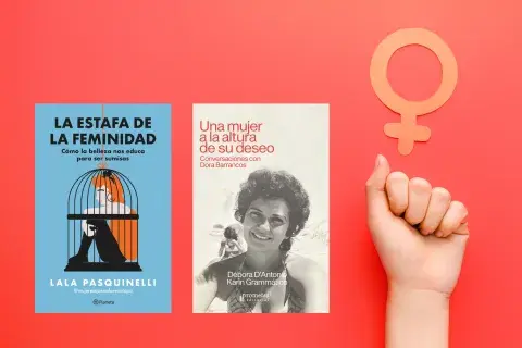 Un puño levantado y el símbolo del feminismo Un puño levantado y el símbolo del feminismo