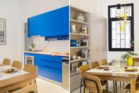 Mesa (Talleres Sustentables) con sillas (Estudio Te) de líneas simples iluminadas por una lámpara colgante de Casa Sud. 