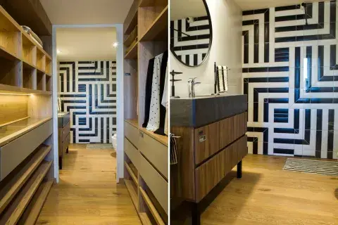 Juego de azulejos rectangulares y el vestidor como antesala del baño en Orlando Deco.