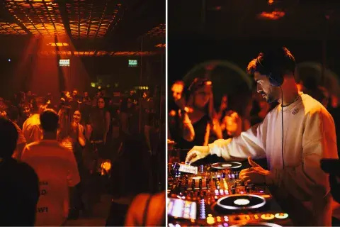 Gente bailando y un DJ pasando música Gente bailando y un DJ pasando música