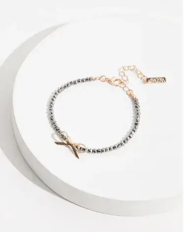Pulsera con  moño, Isadora $5.900