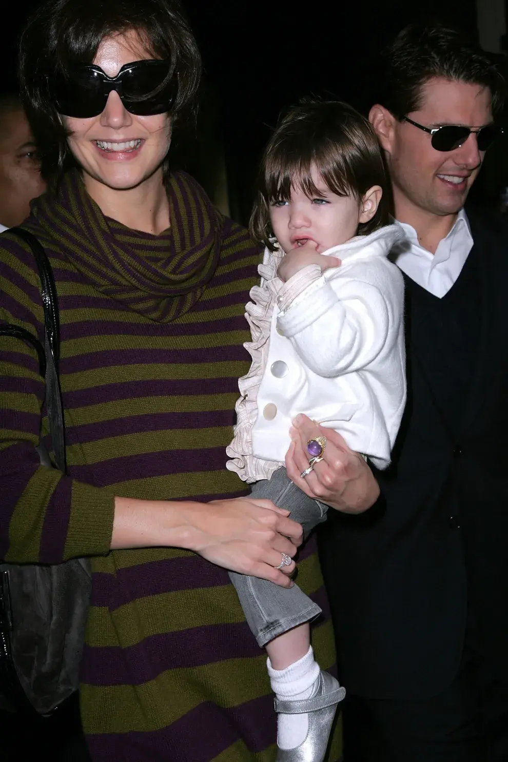 Tom Cruise y Katie Holmes con su pequeña hija, Suri.