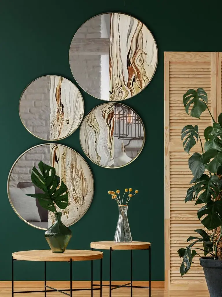 Un rincon de la casa con pared verde y muchos espejos redondos