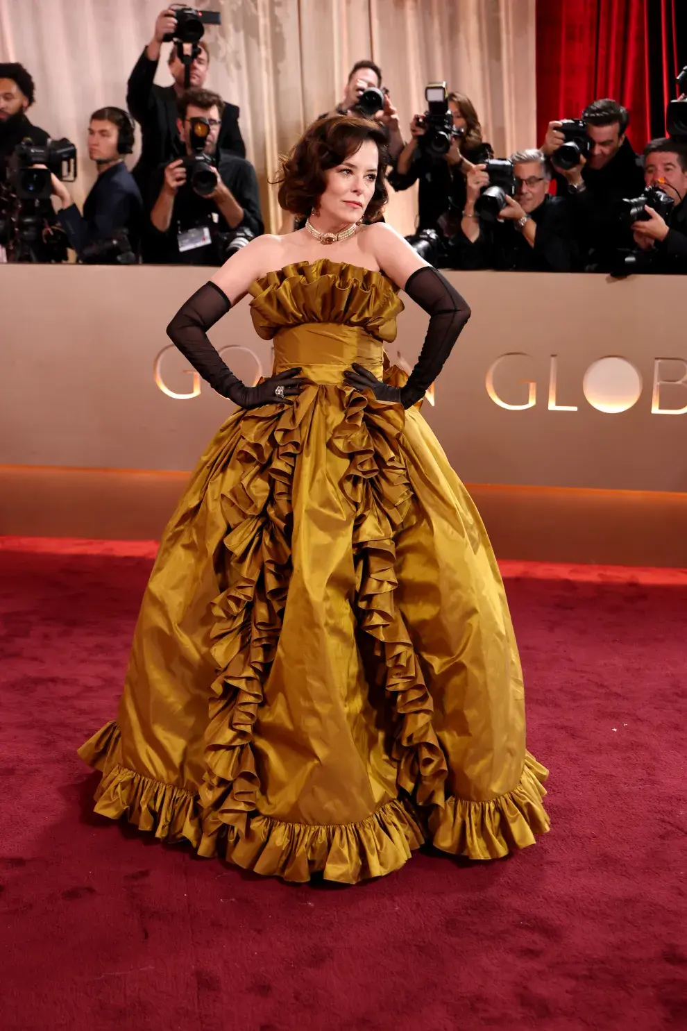 Parker Posey en la alfombra roja de los Golden Globes 2026.