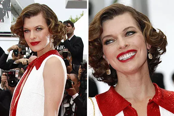 Milla Jovovich también optó por un look con muchas ondas y el flequillo hacia el costado