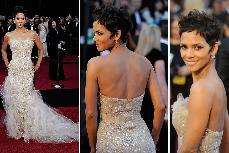 Ultimamente Halle Berry no acierta con su vestuario en las grandes galas; el strapless nude de Marchersa con bordado plateado y mucho pero mucho tul desordenado no la ayudó