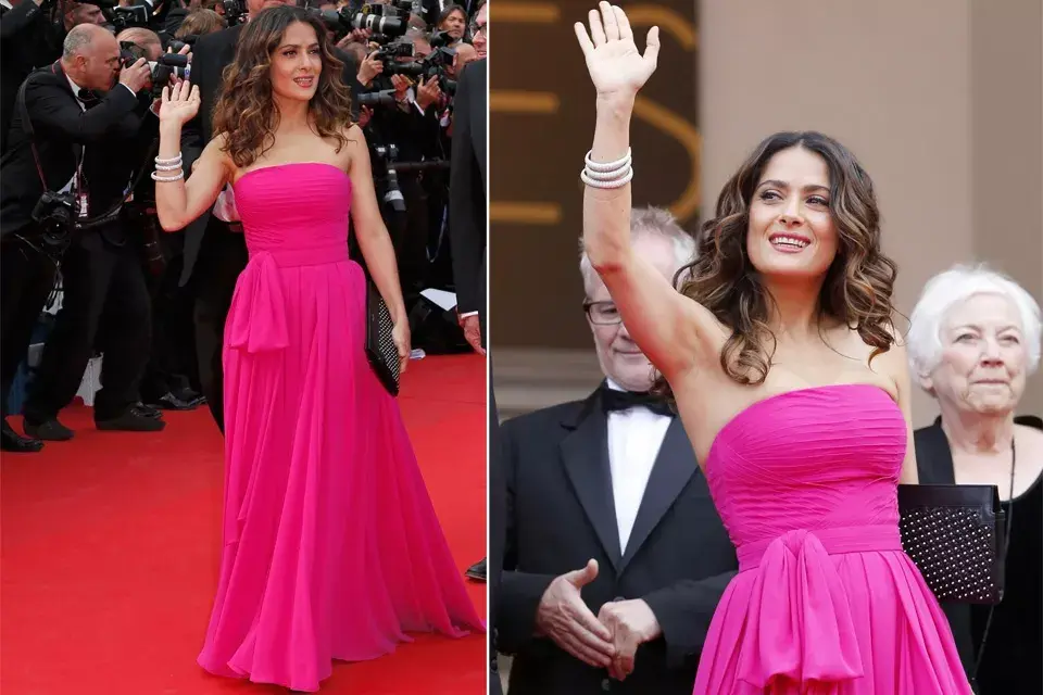 Salma Hayek deslumbró con este Saint Laurent fucsia strapless con lazo en la cintura. ¡Perfecta!