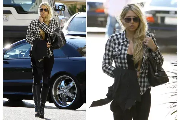 De shopping en Barneys New York, con jeans súper ajustados, botas de caña alta y taco altísimo y camisa a cuadros