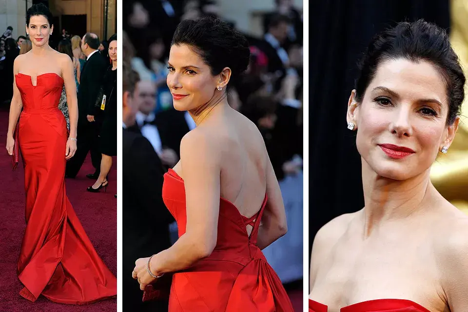 Radiante, Sandra Bullock optó por un strapless de corte sirena en colorado de Vera Wang. Muy bien diez por su peinado recogido