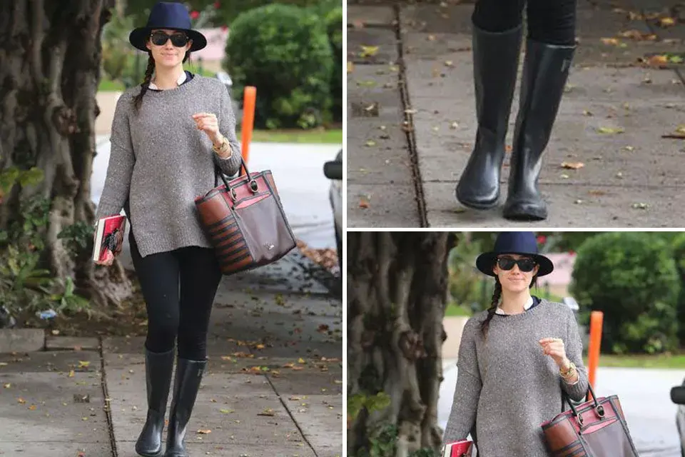 Emmy Rosum con un look un poco más discreto: sombrero, sweater, calzas y botas