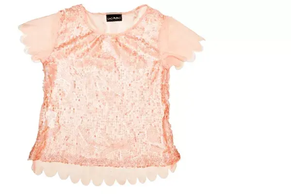 Blusa con paillettes (Las Pepas, $399).