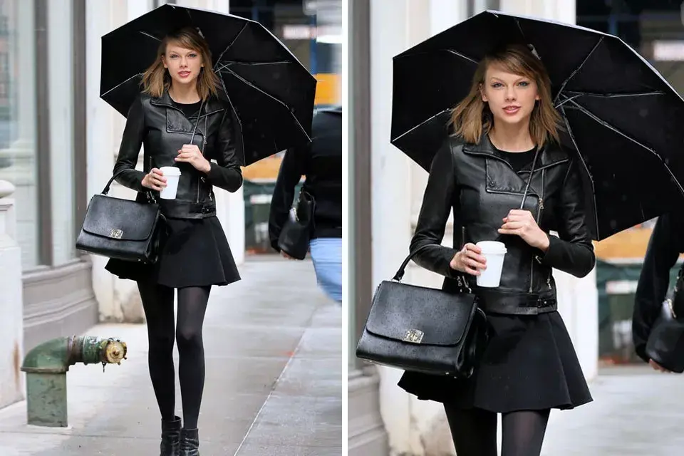 Otra versión de Taylor: chaqueta de cuero, falda corta, botas y paraguas, todo, todo a tono. Eso sí, de las clásicas botitas de lluvia, ni hablar