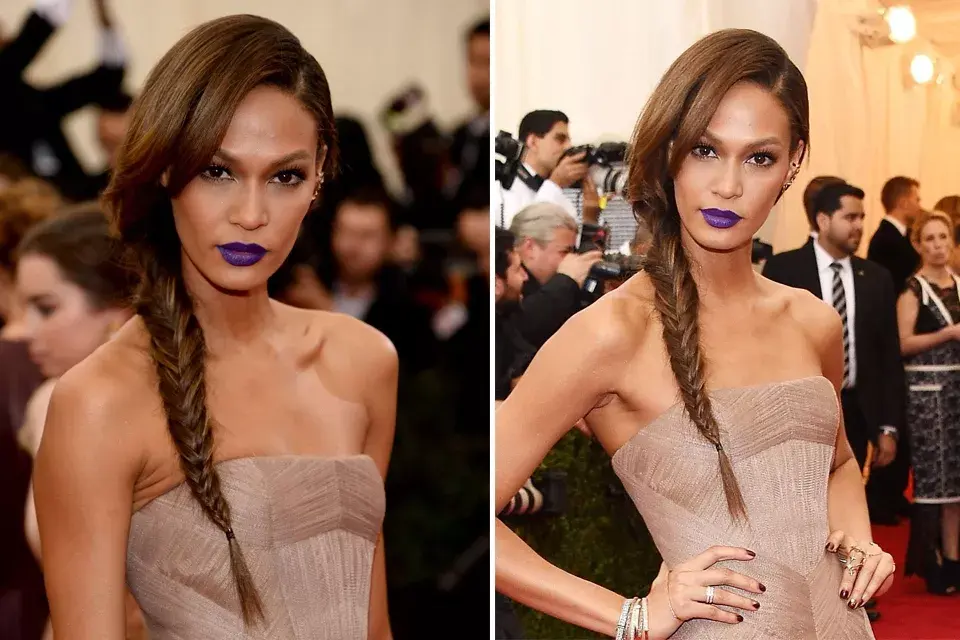 La modelo Joan Smalls, con una trenza tipo espiga, cancherísima, y labios violetas... ¿sí o no?