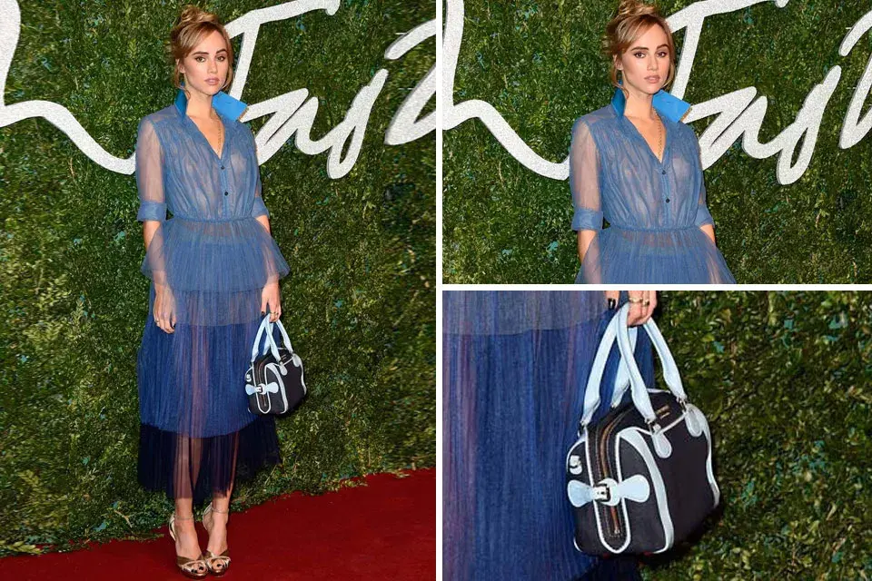 Suki Waterhouse optó por un vestido camisero azul de gasa y volados en degradé de Burberry Prorsum, y lo combinó con una cartera de asa corta en los mismos tonos. ¿Qué te parece su look?