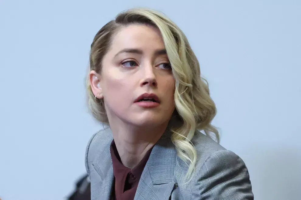 La actriz estadounidense Amber Heard llega al juzgado de circuito del condado de Fairfax en Fairfax, Virginia, el 26 de mayo de 2022. - (Foto de Michael REYNOLDS / POOL / AFP)