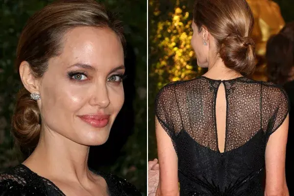 Angelina Jolie, bellísima como siempre, lució un chignon bajo y muy poco make up para acompañar su look. La actriz recibió un oscar honorífico por su labor humanitaria