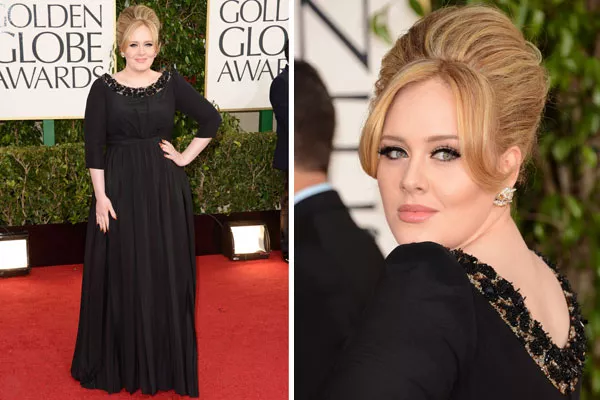 Adele, impecable, con un modelo en negro de Burberry. El detalle, en el escote