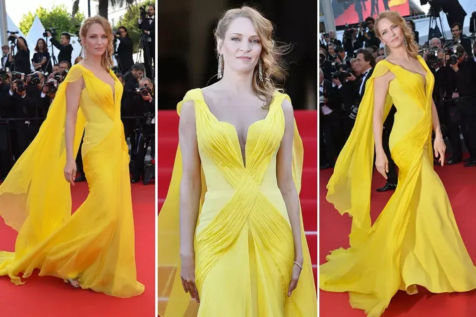 Uma Thurman atravesó la gran alfombra roja con dos looks bien distintos: el primero, de color amarillo intenso con cola y un poco de vuelo en la parte inferior