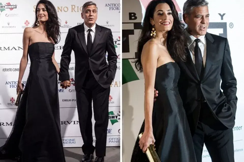 En la alfombra roja con Geoge Clooney luciendo un vestido negro largo con escote palabra de honor