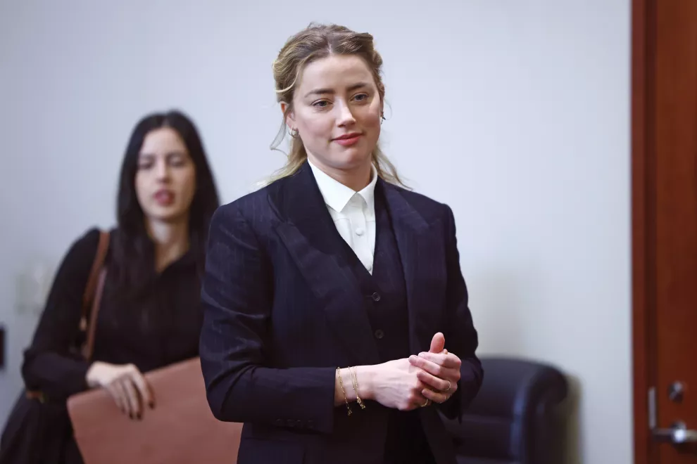 Actor Amber Heard arrives in the courtroom at the Fairfax County Circuit Court in Fairfax, Va (Jim Lo Scalzo/Pool Photo via AP)