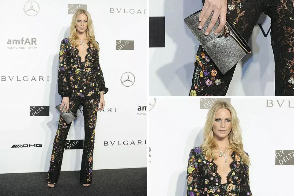 Poppy Delevingne con un estilismo ¡es-pec-ta-cu-lar!; Tuxedó negro con detalles de encaje, de Peter Dundas para Emilio Pucci