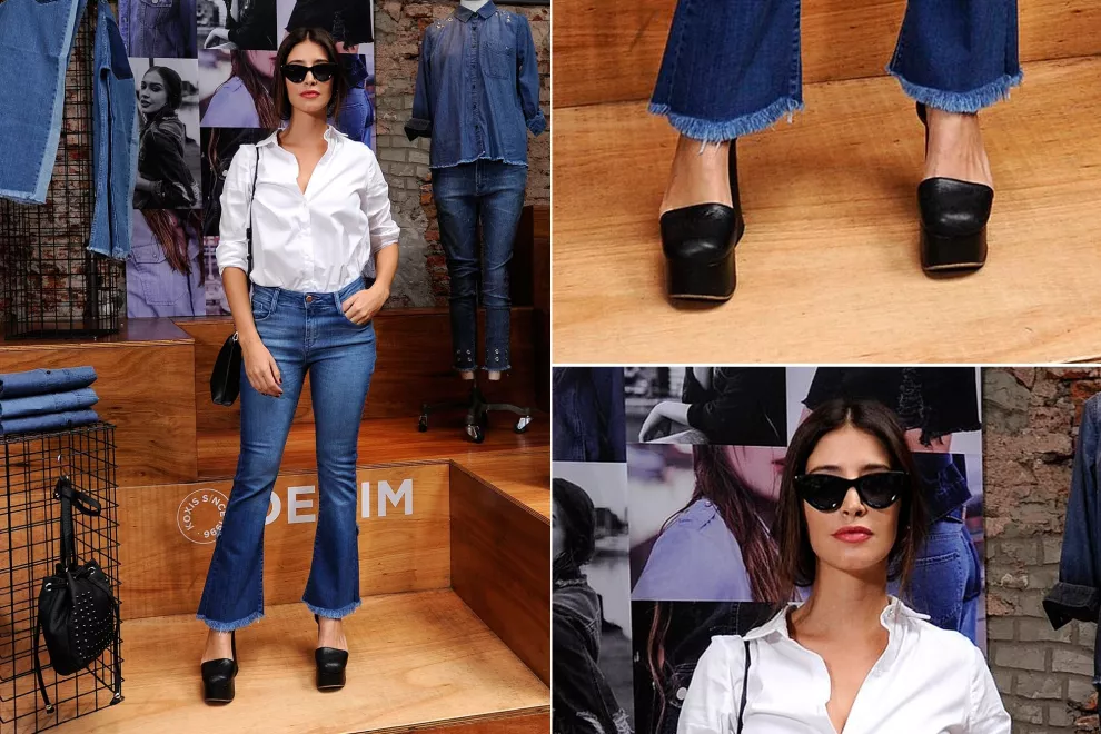 Agustina Córdova vestida con todo lo que dicta la moda esta temporada: jeans desflecados, anteojos "Cat Eye", camisa sastrera blanca y plataformas