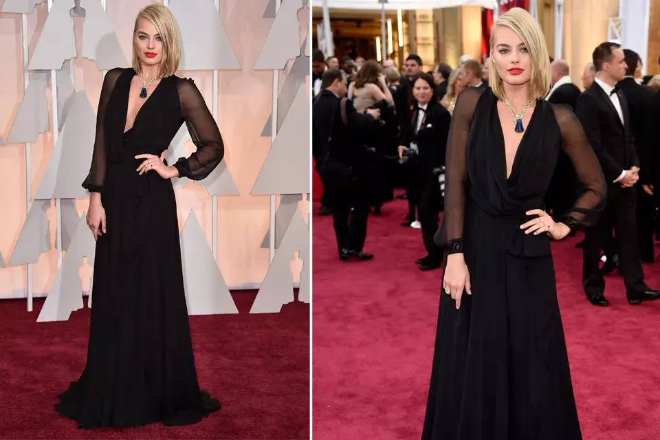 Margot Robbie lució un vestido de Saint Laurent con mega escote y mangas transparentes. Espectacular el collar vintage de Van Cleef and Arpels