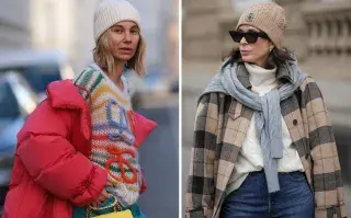 una mujer caminando por la calle abrigada por el frio
